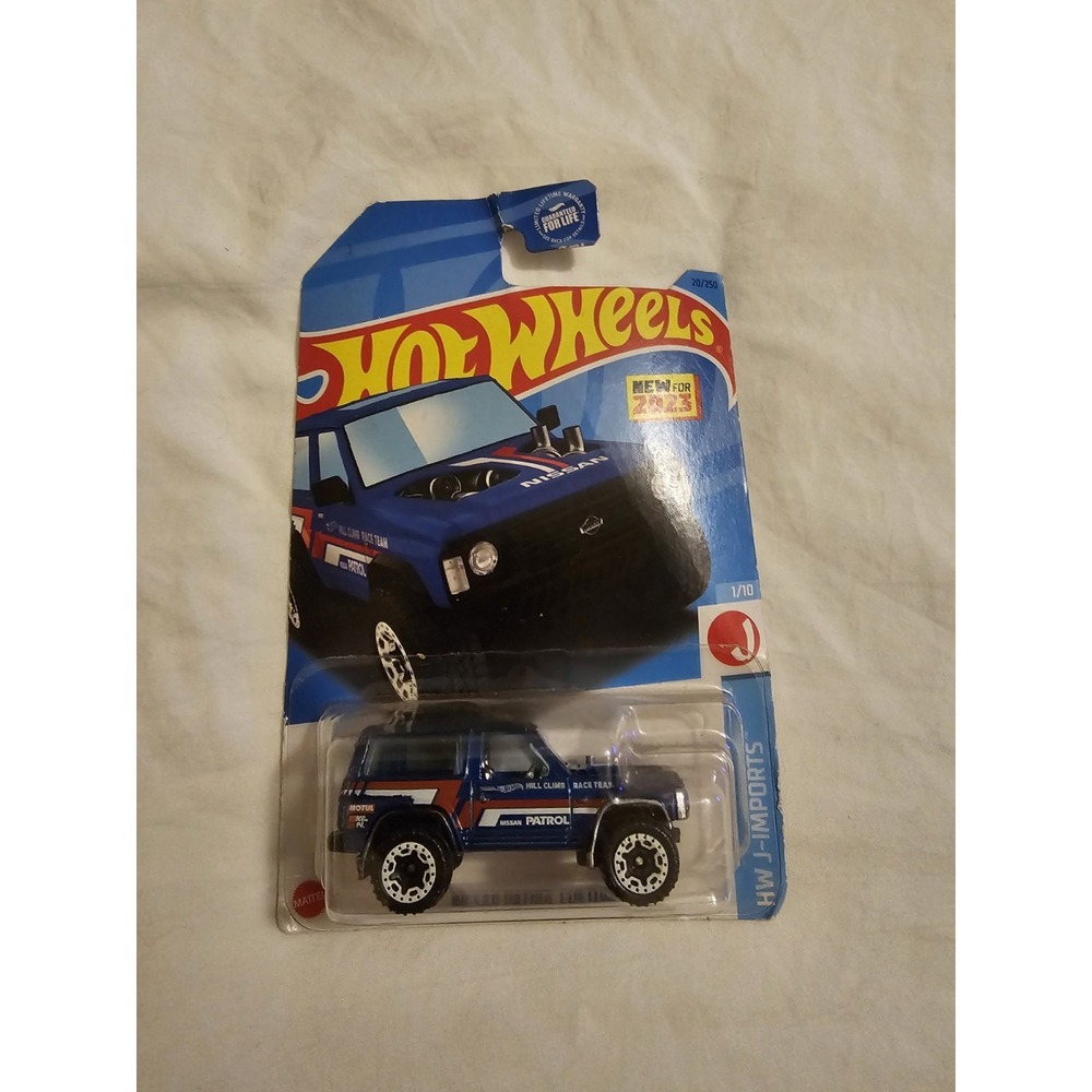 Hot Wheels Nissan Patrol Custom HW J-Imports 1/10 Blue – Card Damage‎